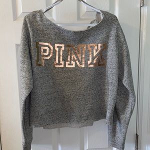 off the shoulder sweater with an open back.